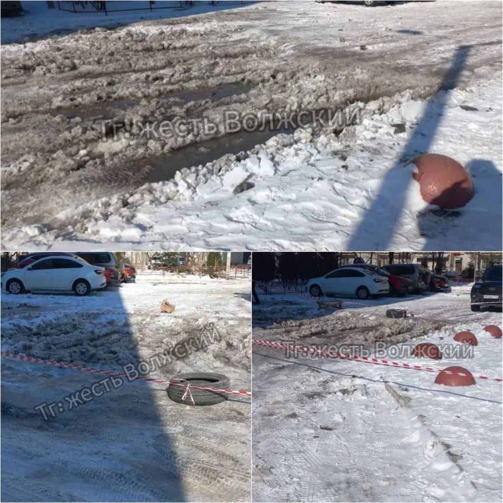 Необычное решение: покрышка с флажками вместо ремонта ямы на парковке